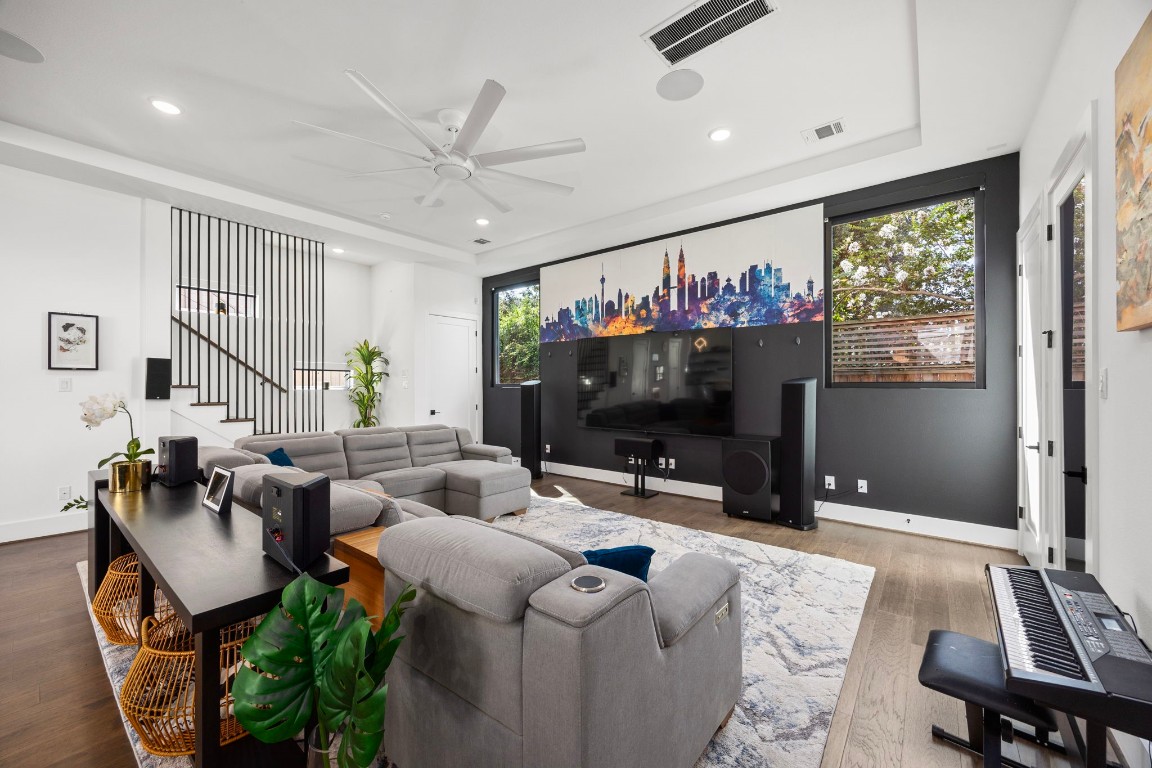 424 Redan Street Houston, TX 77009 - Photo 14 of 47 a living room with furniture a flat screen tv and a large window