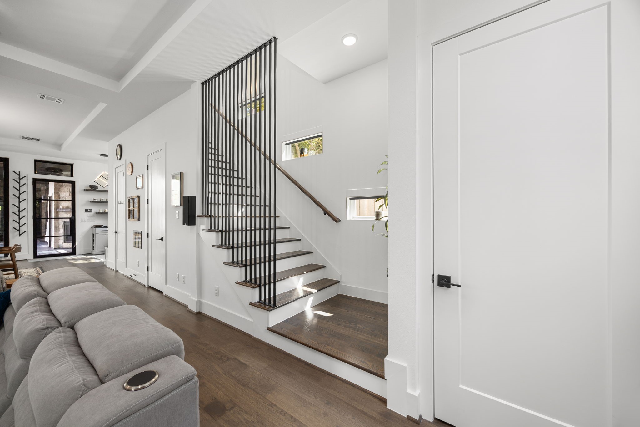 424 Redan Street Houston, TX 77009 - Photo 15 of 47 a living room with furniture and a stair with wooden floor