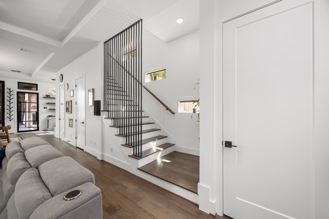 424 Redan Street Houston, TX 77009 - Photo 15 of 47 a living room with furniture and a stair with wooden floor