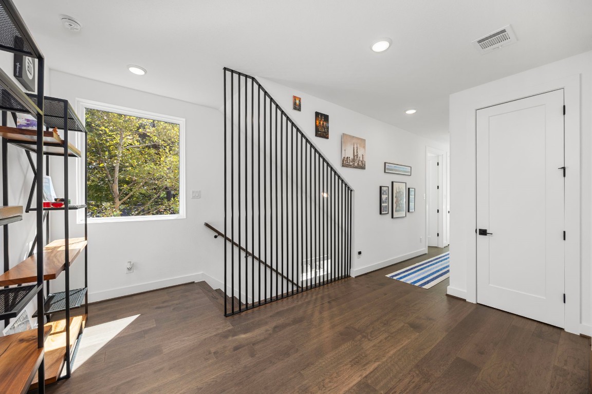 424 Redan Street Houston, TX 77009 - Photo 16 of 47 a view of a hallway with wooden floor and entryway