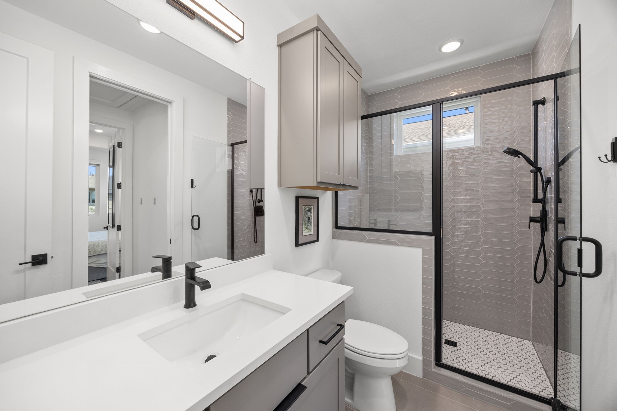 424 Redan Street Houston, TX 77009 - Photo 18 of 47 a bathroom with a sink toilet and shower