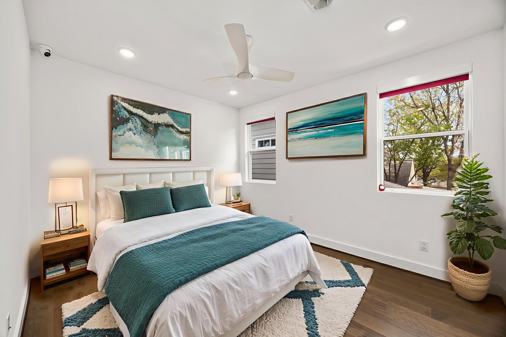 424 Redan Street Houston, TX 77009 - Photo 19 of 47 a bedroom with a large bed and a potted plant