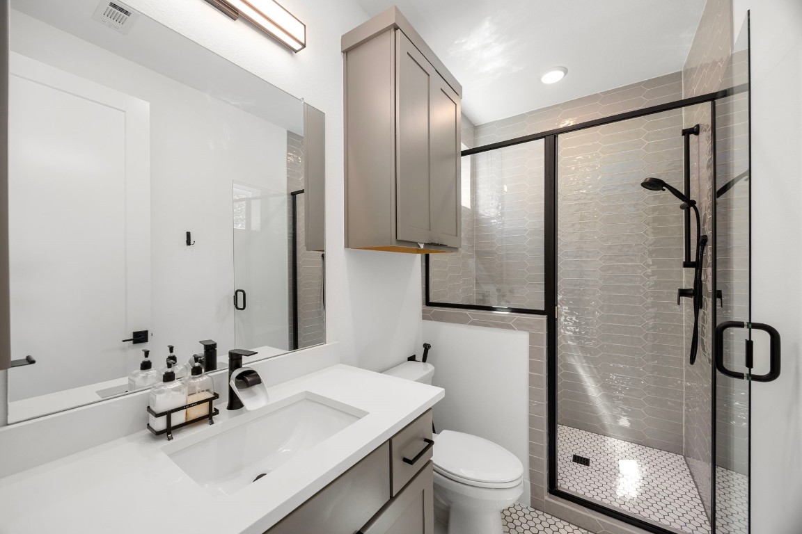 424 Redan Street Houston, TX 77009 - Photo 20 of 47 a bathroom with a sink toilet and shower