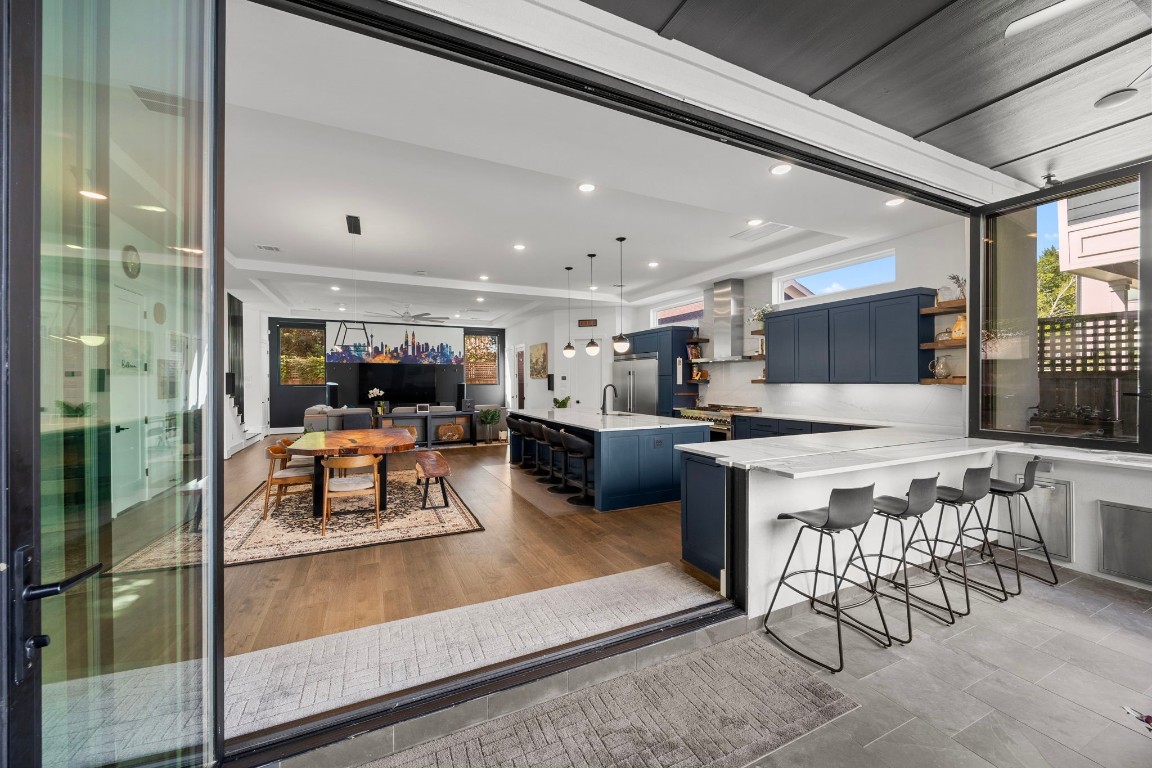 424 Redan Street Houston, TX 77009 - Photo 2 of 47 a living room with stainless steel appliances kitchen island granite countertop furniture and a view of kitchen