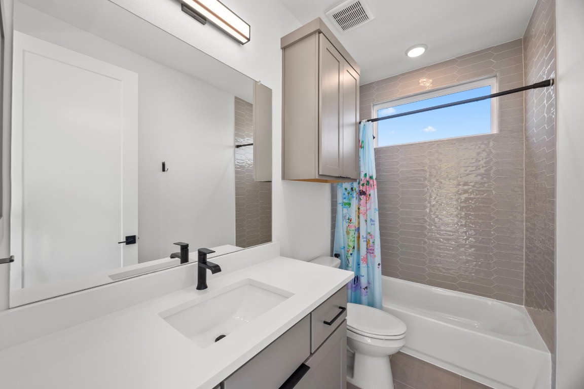 424 Redan Street Houston, TX 77009 - Photo 24 of 47 a bathroom with a sink toilet and shower