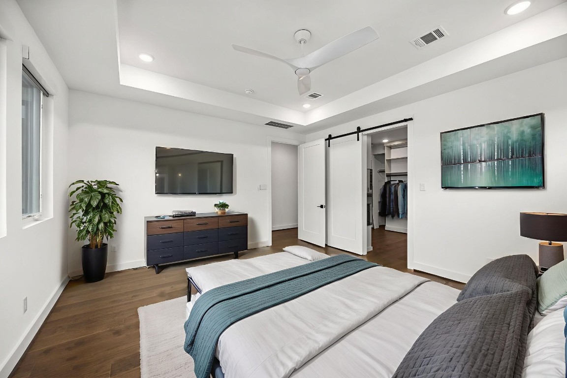 424 Redan Street Houston, TX 77009 - Photo 26 of 47 a bedroom with a bed and a flat screen tv