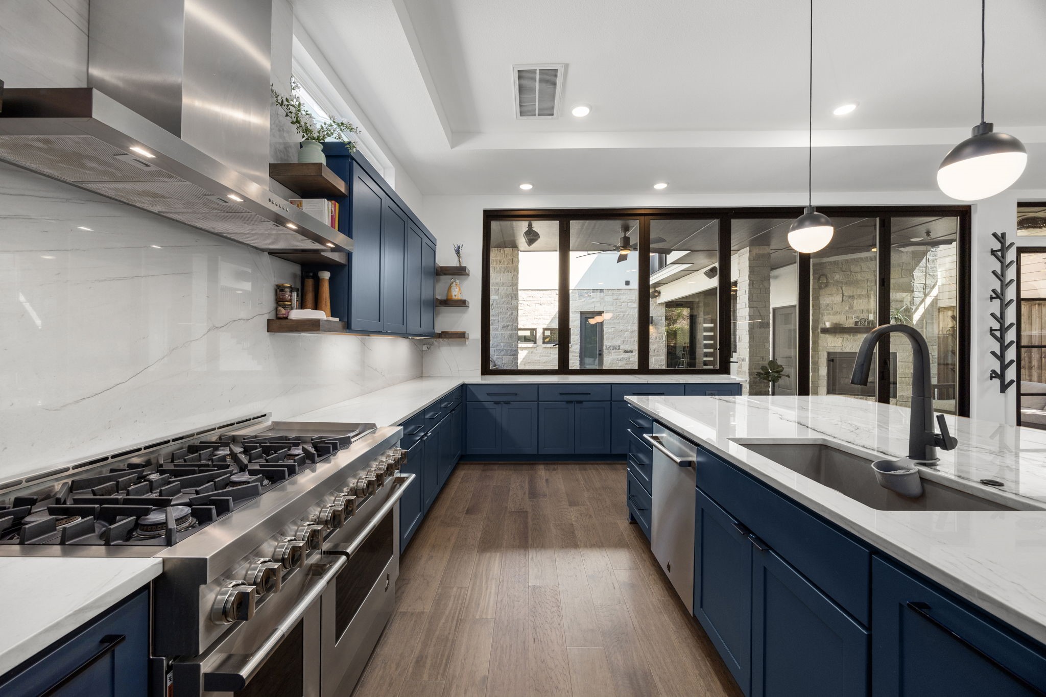 424 Redan Street Houston, TX 77009 - Photo 3 of 47 a kitchen with a stove a sink a bath tub and a counter space