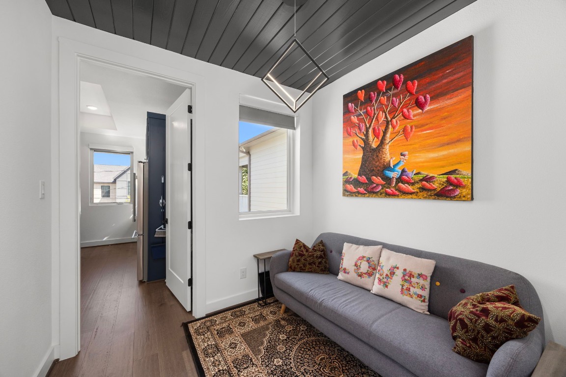 424 Redan Street Houston, TX 77009 - Photo 32 of 47 a living room with furniture and wooden floor