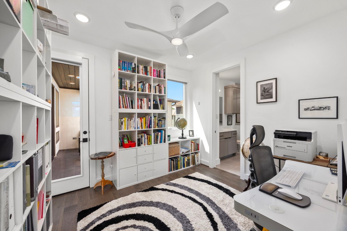 424 Redan Street Houston, TX 77009 - Photo 38 of 47 a bedroom with furniture and a book shelf