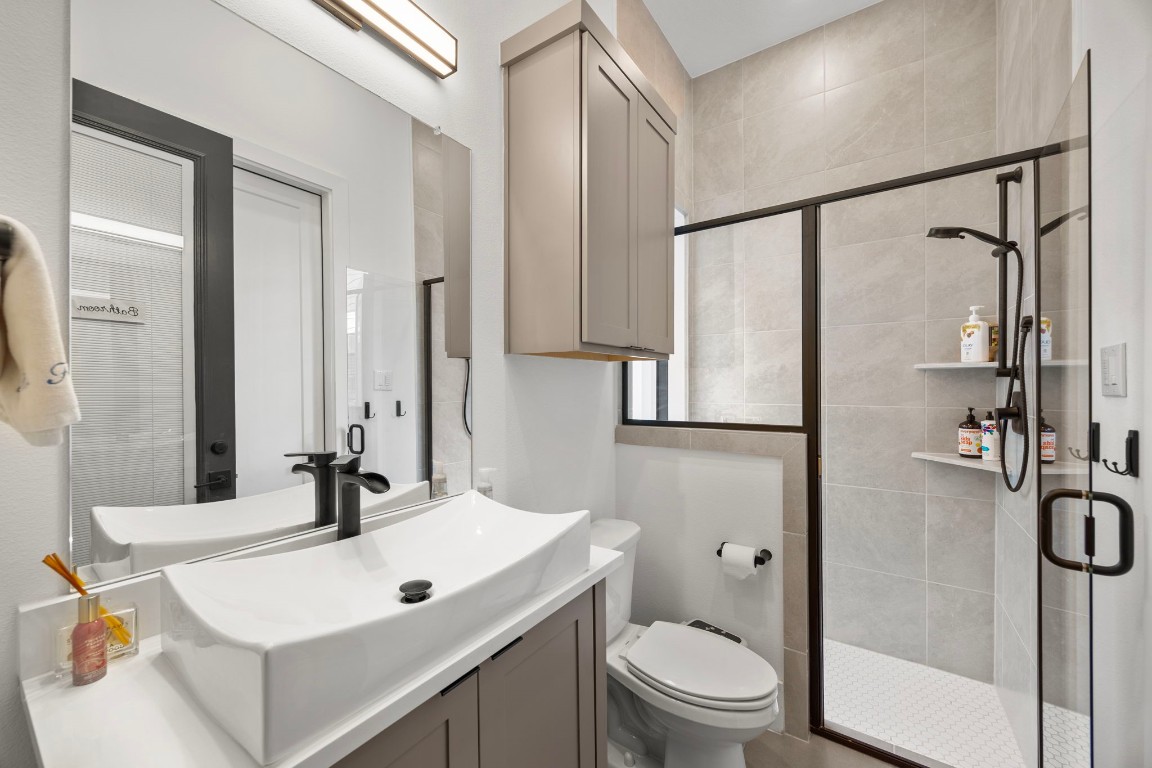 424 Redan Street Houston, TX 77009 - Photo 39 of 47 a bathroom with a sink toilet and shower