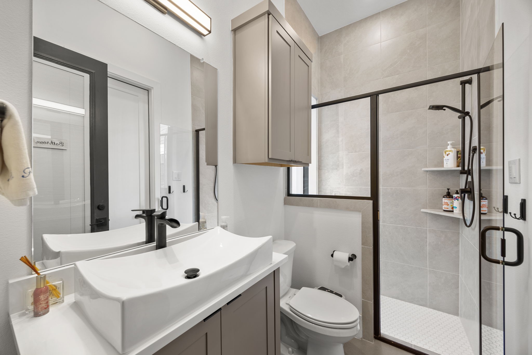 424 Redan Street Houston, TX 77009 - Photo 39 of 47 a bathroom with a sink toilet and shower