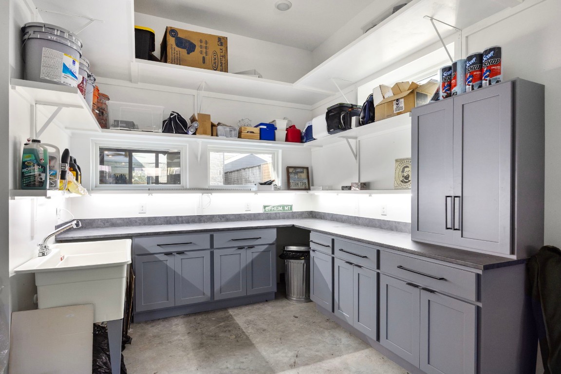 424 Redan Street Houston, TX 77009 - Photo 44 of 47 a kitchen with cabinets a sink and appliances