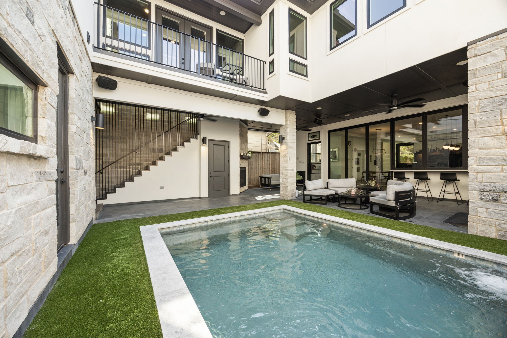 424 Redan Street Houston, TX 77009 - Photo 5 of 47 a view of a patio with table and chairs and potted plants