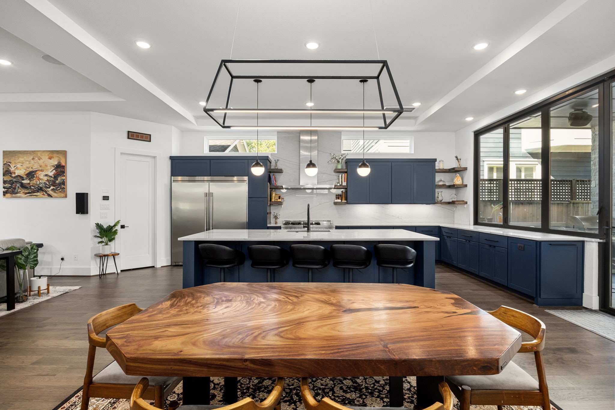 424 Redan Street Houston, TX 77009 - Photo 9 of 47 a kitchen with a table chairs stove and refrigerator