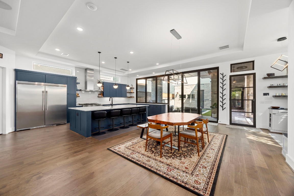 424 Redan Street Houston, TX 77009 - Photo 10 of 47 a large kitchen with a table and chairs