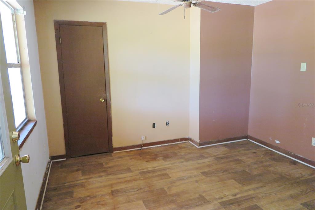 153-UNIT Ranch Road San Mateo, FL 32187 - Photo 10 of 34 an empty room with a empty space and a window