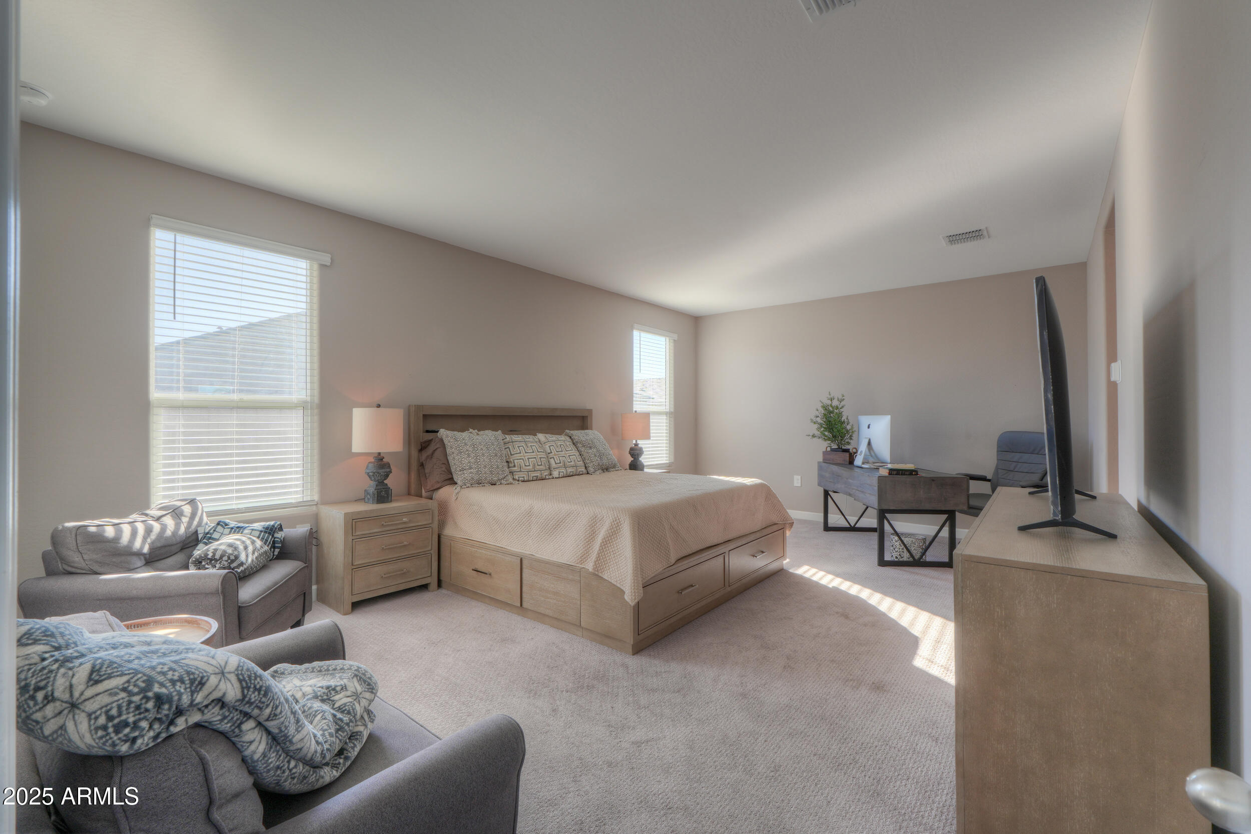 44583 West Palo Olmo Road Maricopa, AZ 85138 - Photo 30 of 43 a bedroom with a bed couch and window