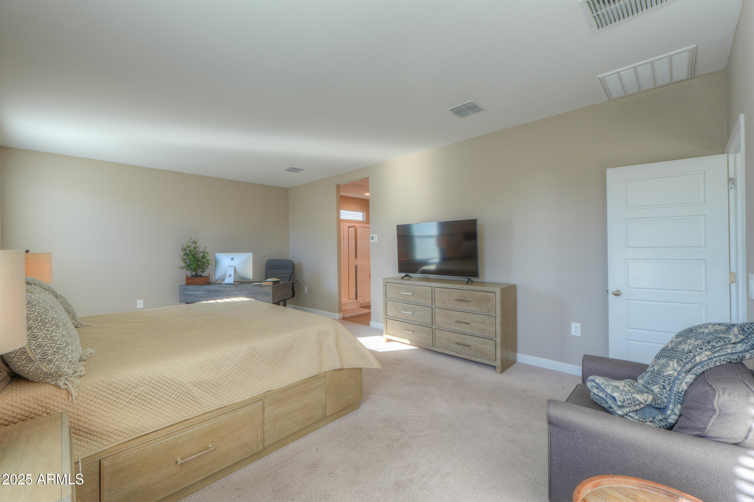 44583 West Palo Olmo Road Maricopa, AZ 85138 - Photo 31 of 43 a bedroom with a bed and flat screen tv