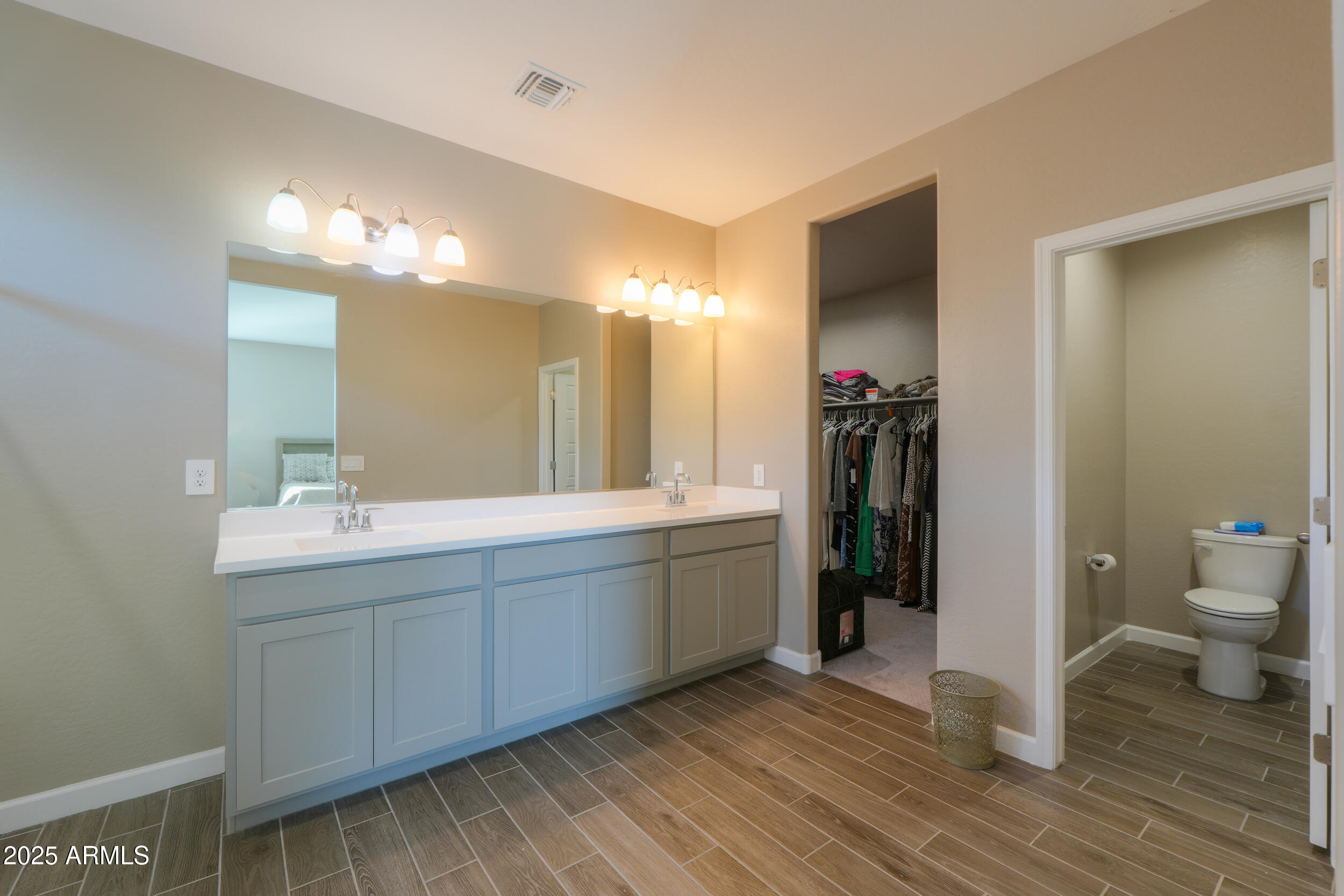 44583 West Palo Olmo Road Maricopa, AZ 85138 - Photo 33 of 43 a bathroom with a double vanity sink mirror and toilet