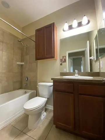 a bathroom with a sink a toilet and a bathtub