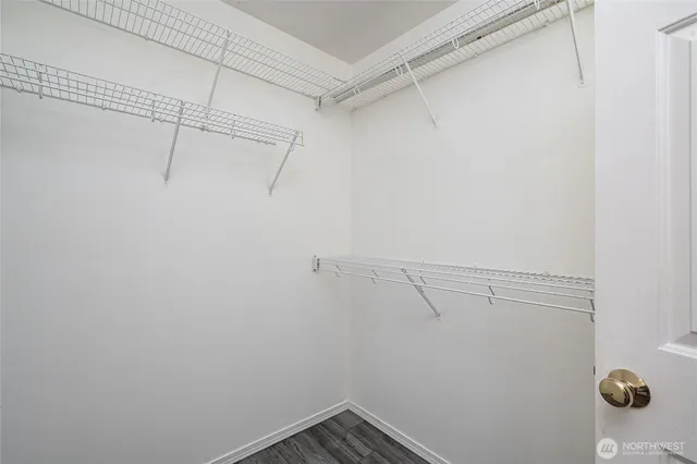 a view of storage and utility room with racks on the wall
