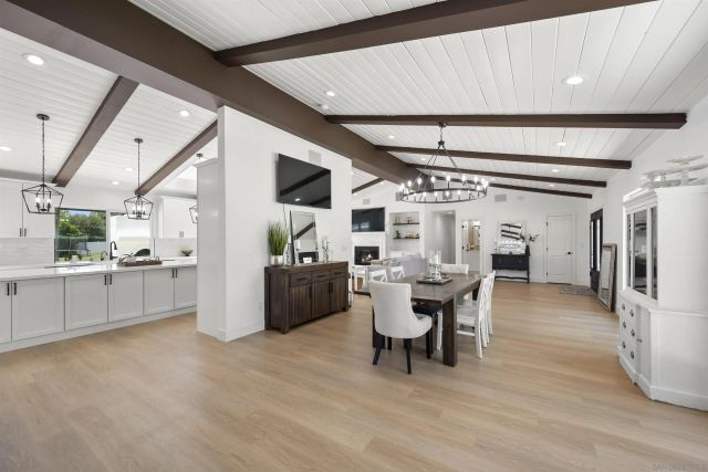 a kitchen with stainless steel appliances kitchen island granite countertop a sink and cabinets