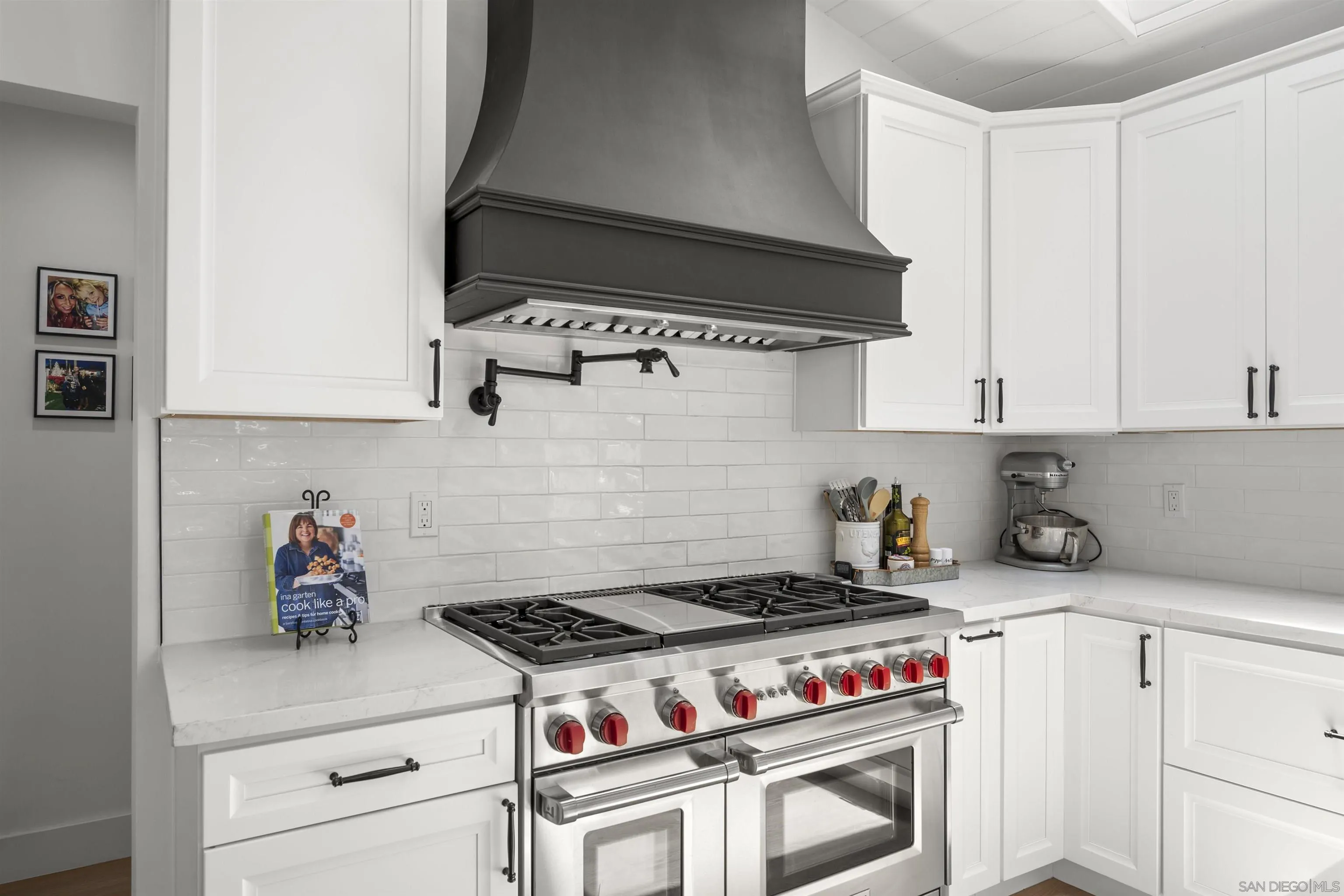 13367 Calle Colina Poway, CA 92064 - Photo 17 of 60 a stove top oven sitting inside of a kitchen