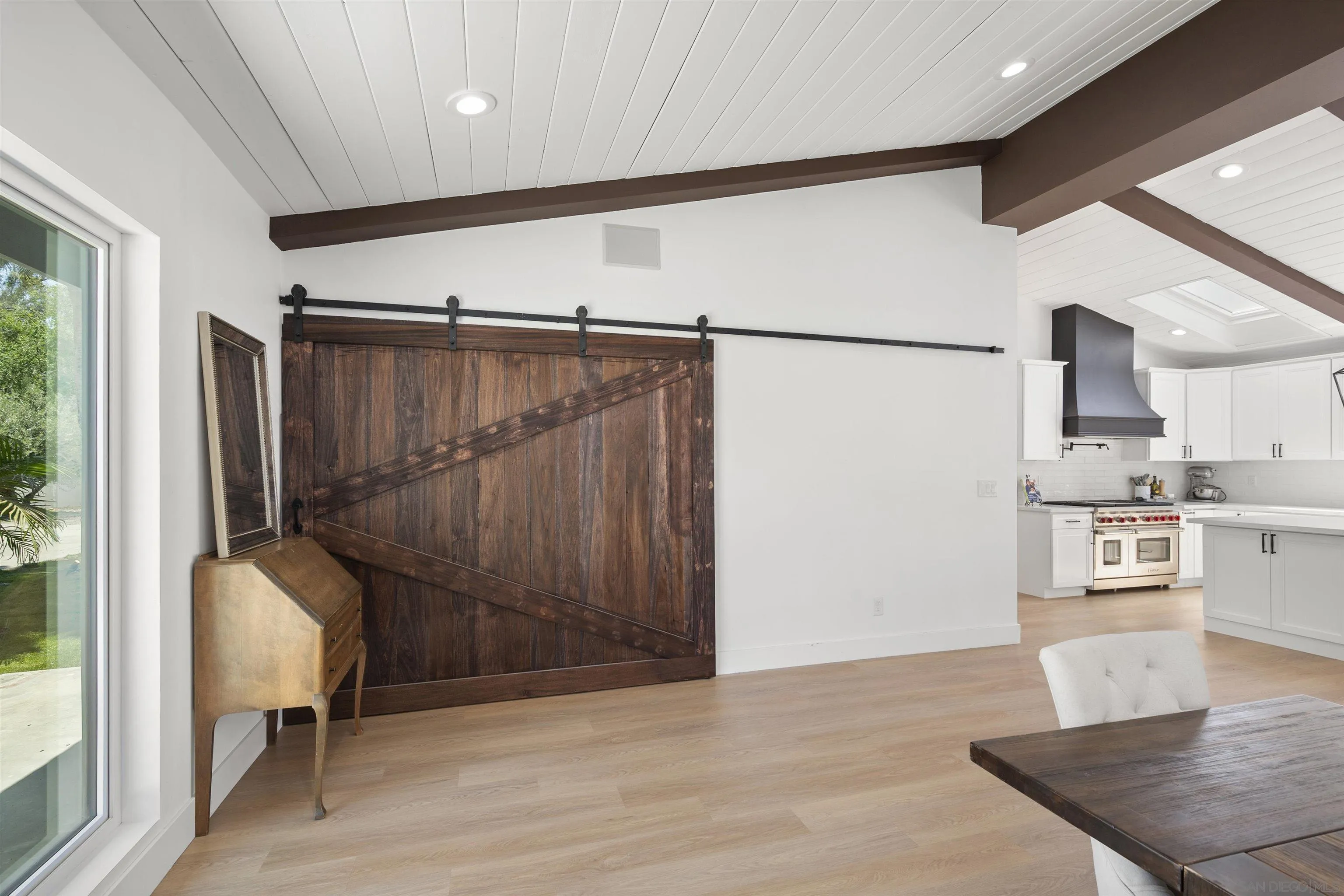 13367 Calle Colina Poway, CA 92064 - Photo 23 of 60 a view of a hallway with wooden floor and windows
