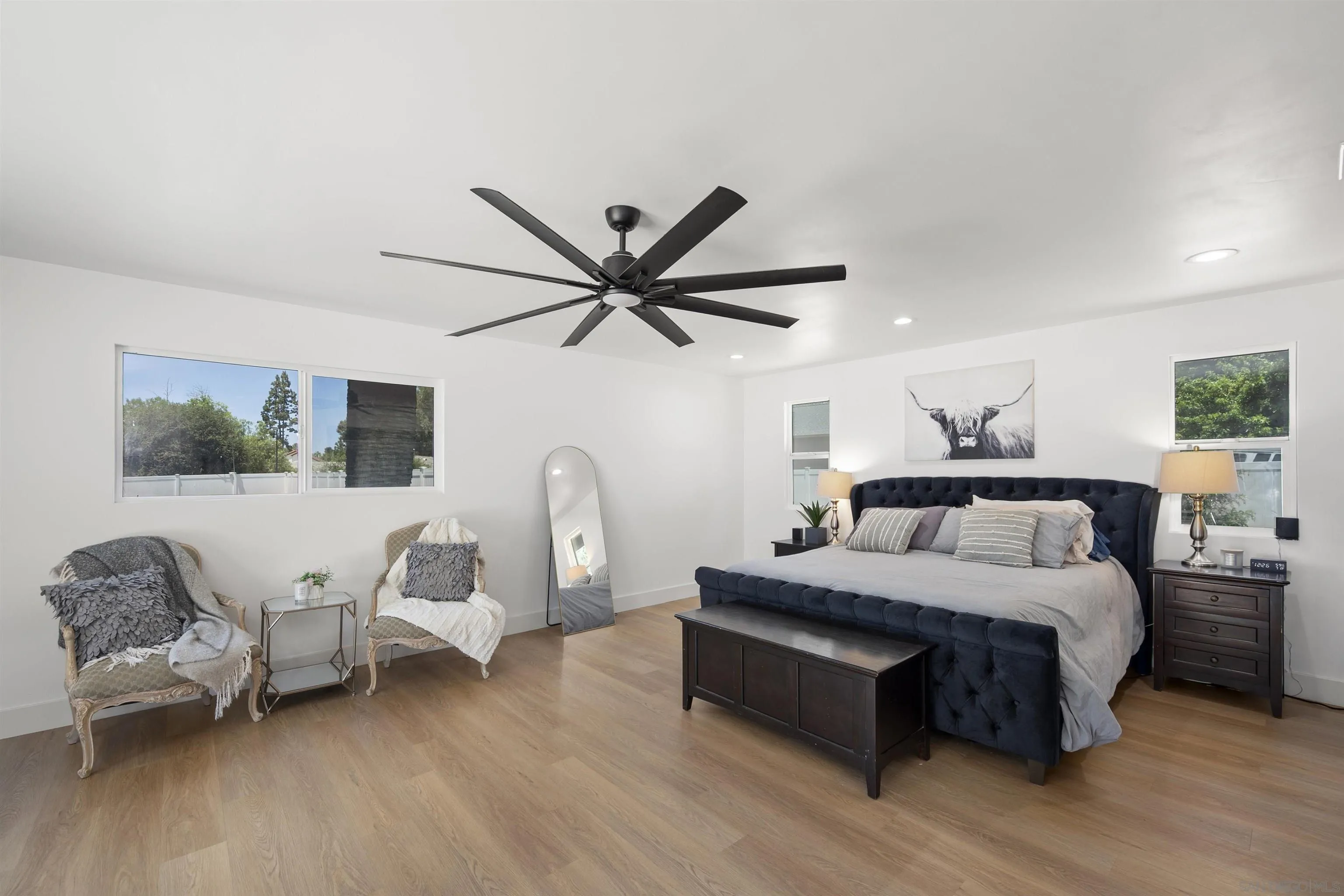 13367 Calle Colina Poway, CA 92064 - Photo 26 of 60 a bedroom with a bed and wooden floor