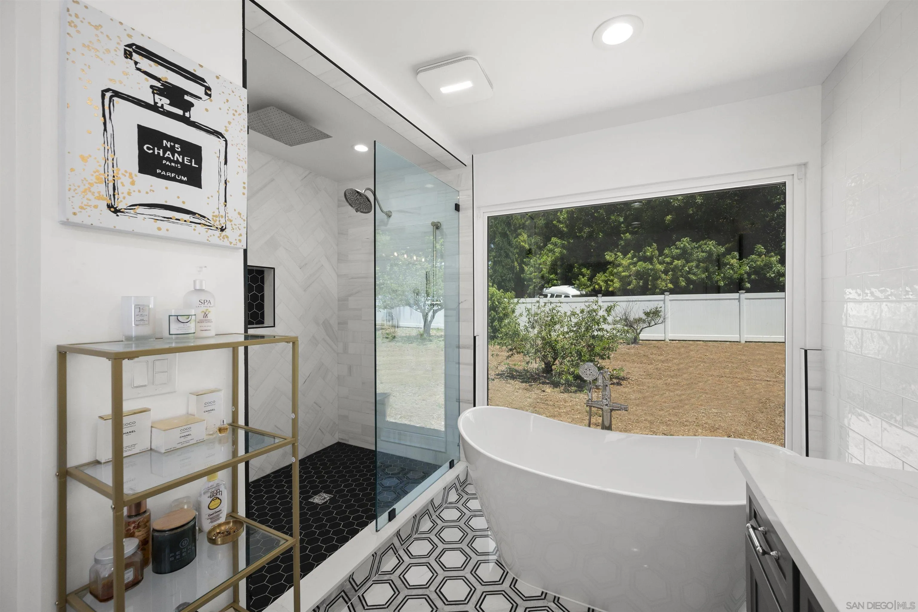 13367 Calle Colina Poway, CA 92064 - Photo 28 of 60 a bathroom with a bathtub and a shower