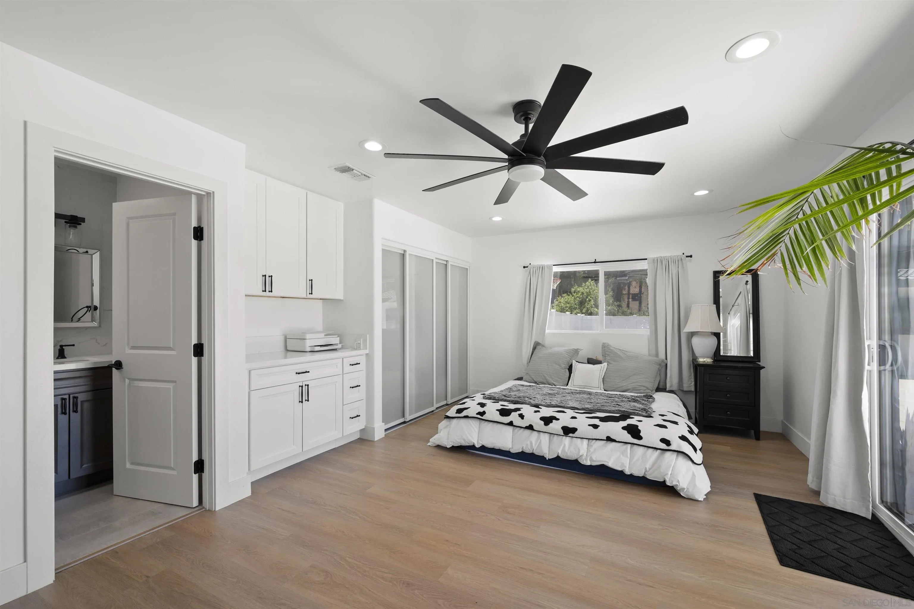 13367 Calle Colina Poway, CA 92064 - Photo 31 of 60 a bedroom with a bed and a chandelier