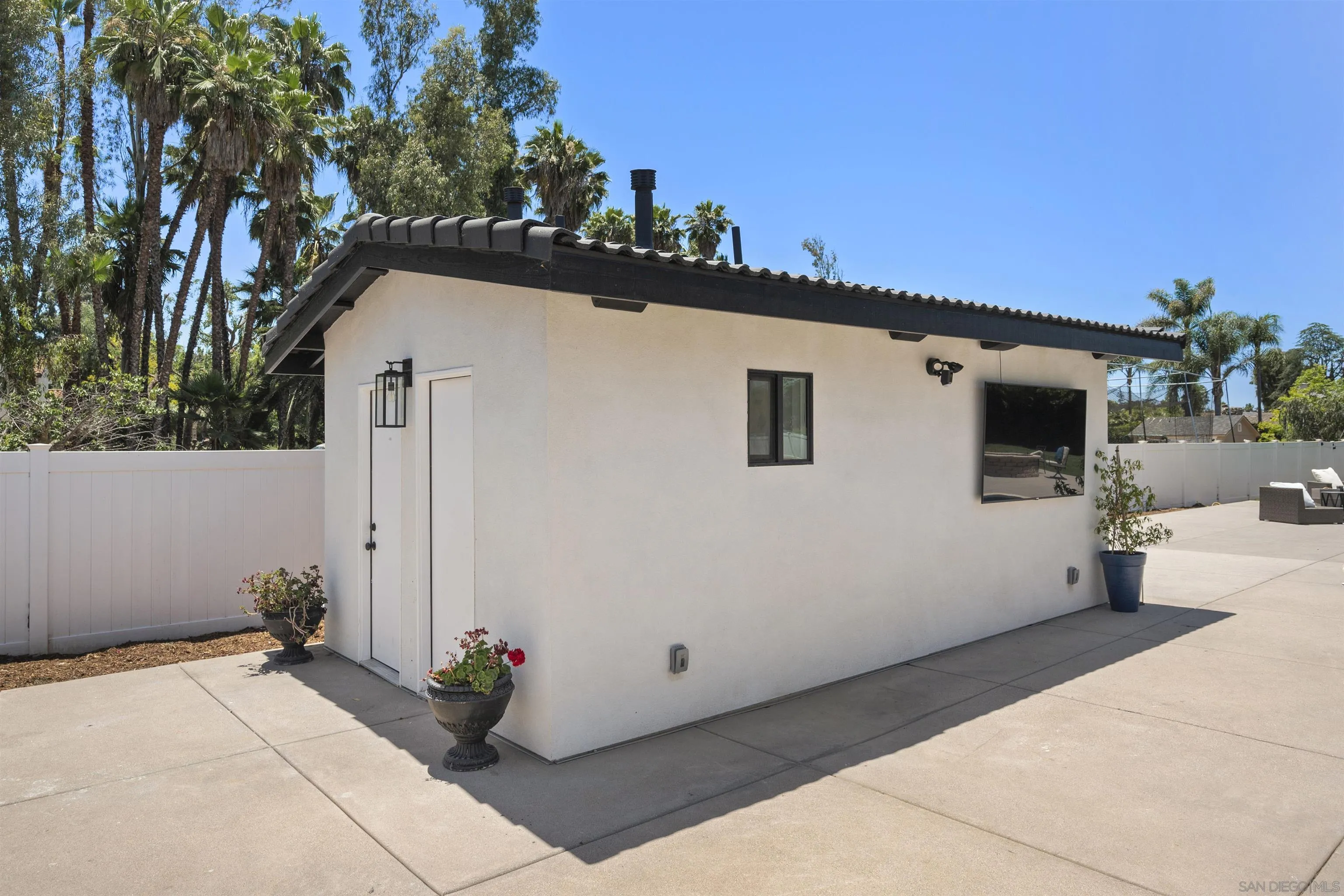 13367 Calle Colina Poway, CA 92064 - Photo 49 of 60 a view of a white house with a outdoor space