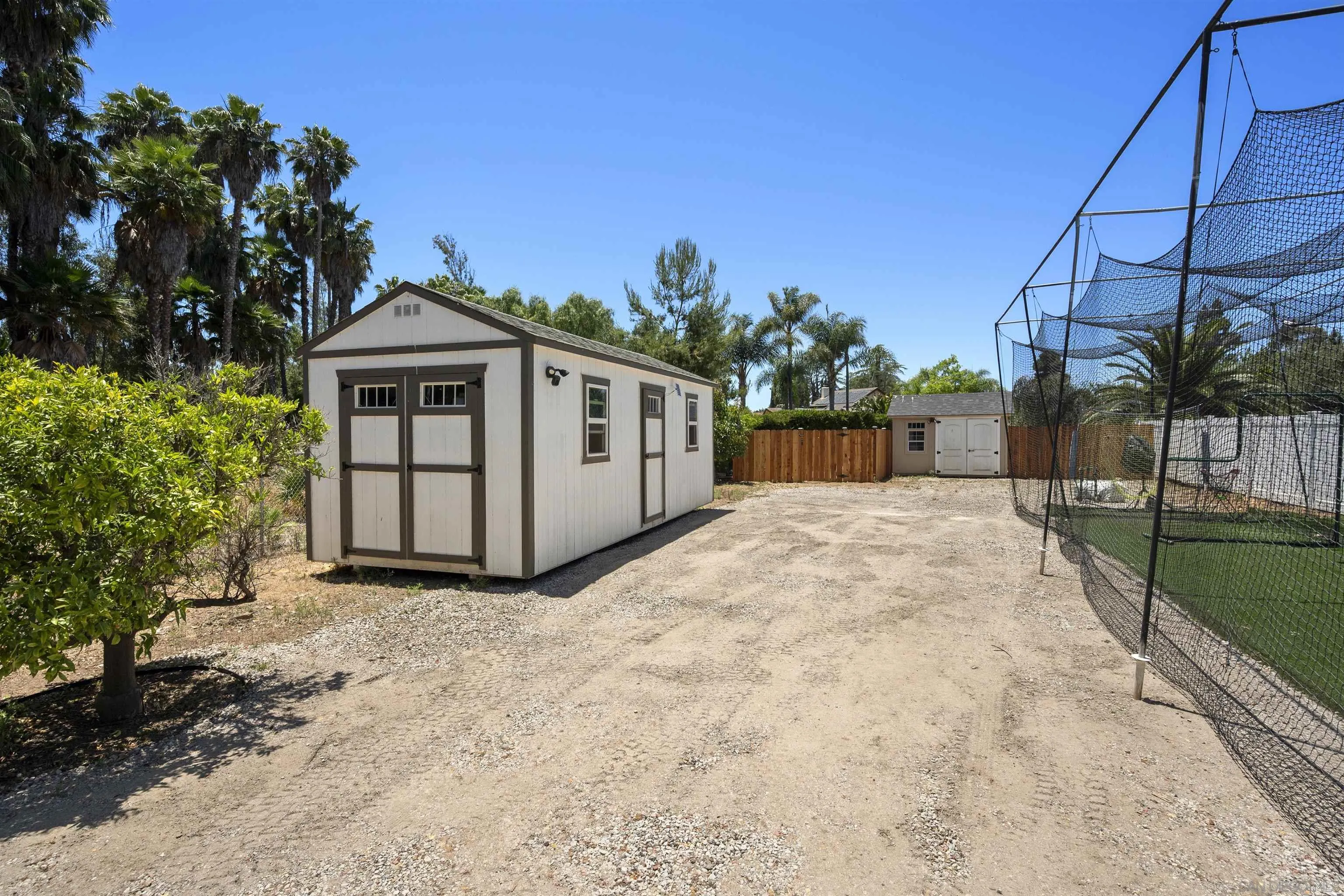 13367 Calle Colina Poway, CA 92064 - Photo 50 of 60 a view of a house with a yard and potted plants
