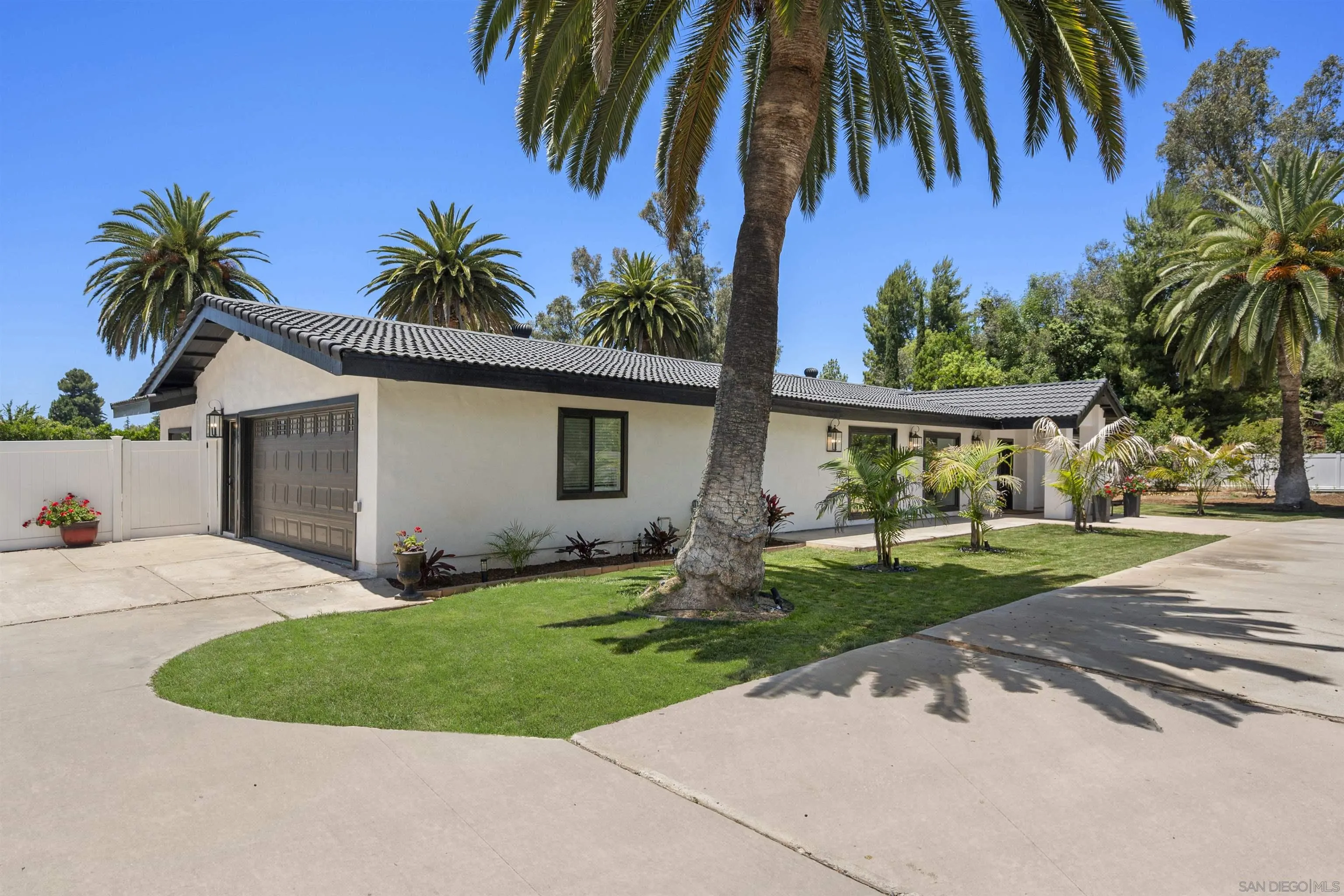 13367 Calle Colina Poway, CA 92064 - Photo 52 of 60 a front view of house with yard and outdoor seating