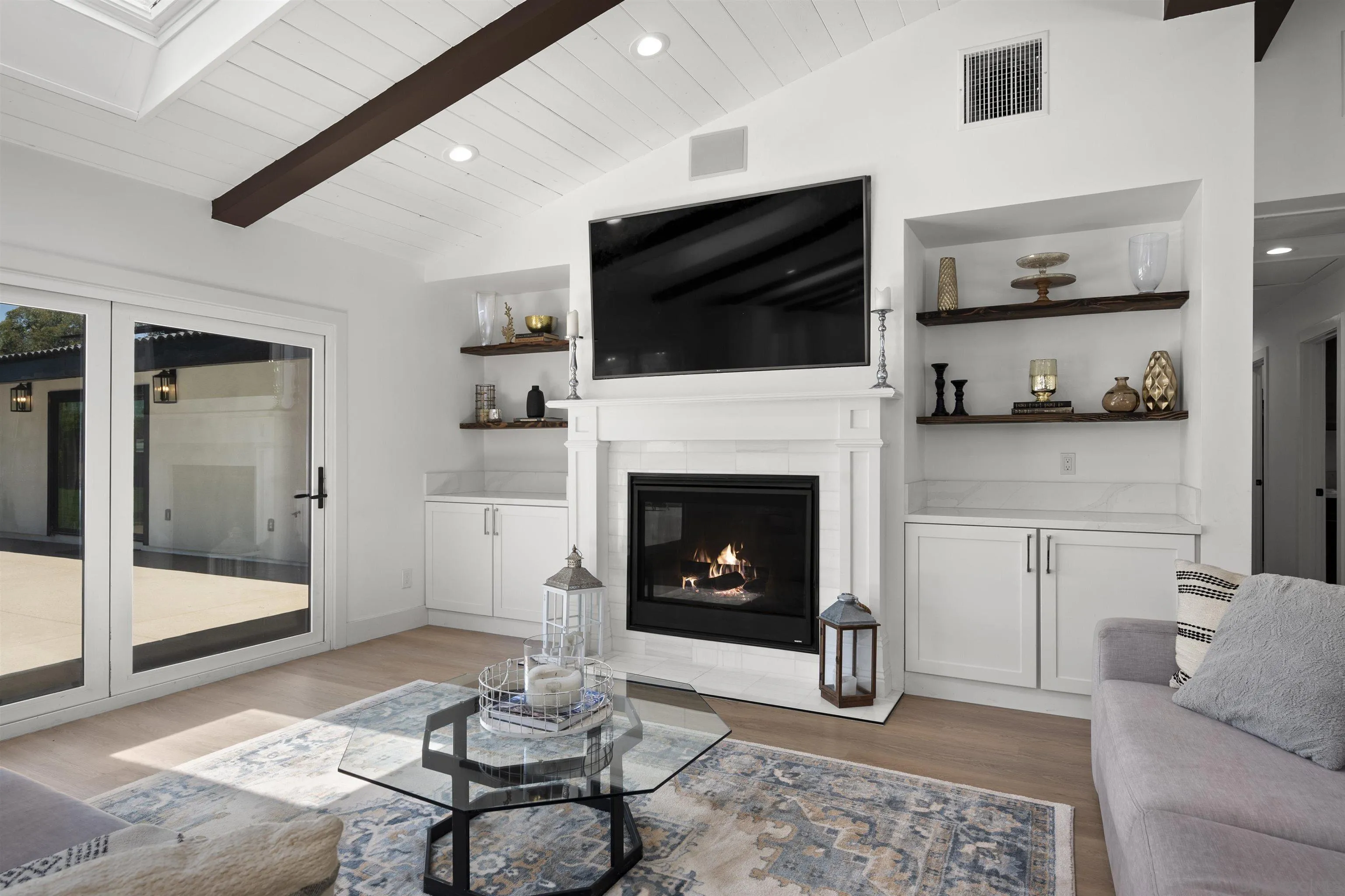 13367 Calle Colina Poway, CA 92064 - Photo 9 of 60 a living room with furniture a flat screen tv and a fireplace