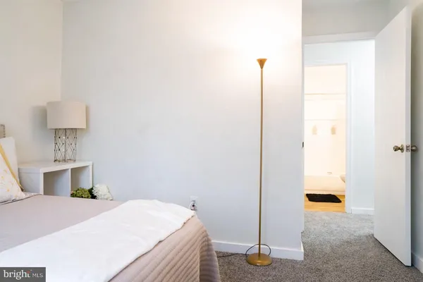 a bedroom with a bed and a table