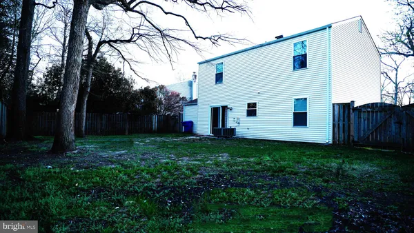 a view of a back yard of the house