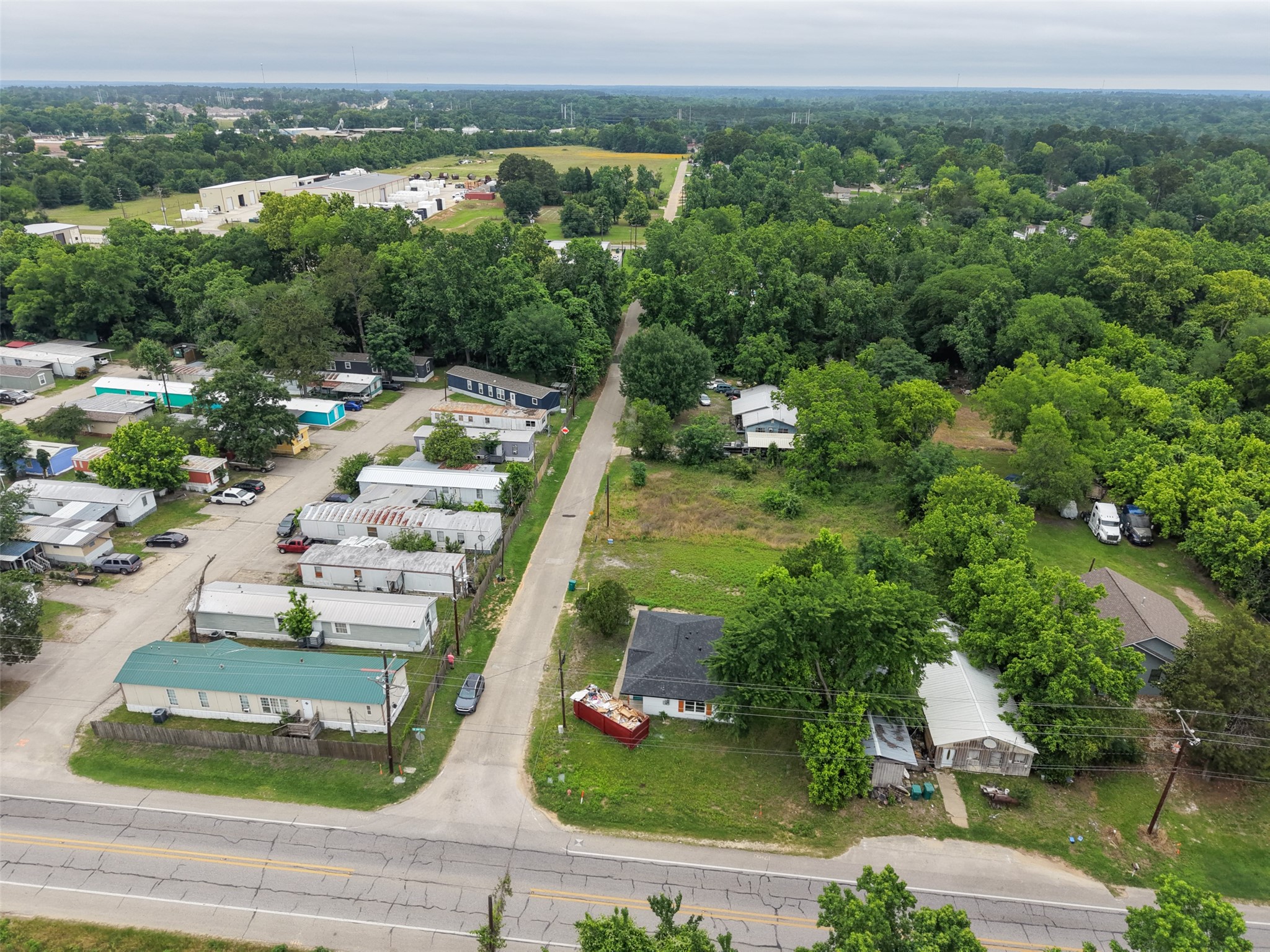 0 Mill Street Willis, TX 77378 - Photo 19 of 24 an aerial view of a house with a yard and lake view