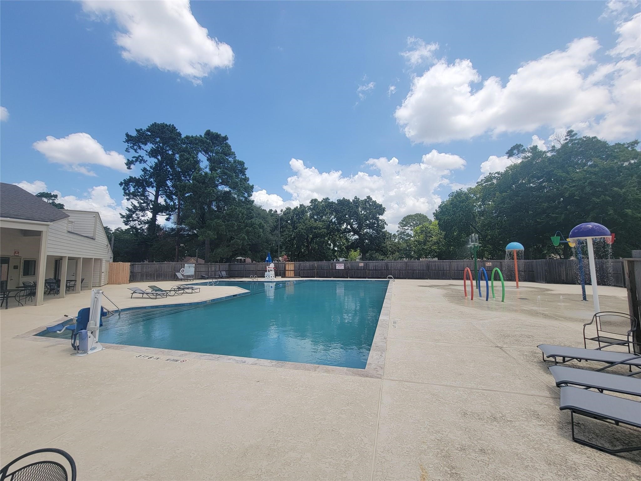 17314 Chapel Pine Street Spring, TX 77379 - Photo 41 of 44 Adjacent to the clubhouse is the neighborhood pool with a splashpad.