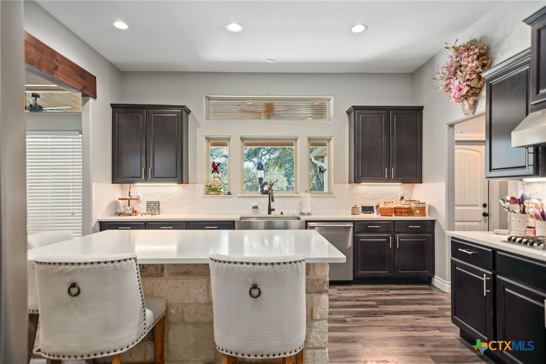 437 Bischoff Road Inez, TX 77968 - Photo 11 of 47 a kitchen with a sink stove and cabinets