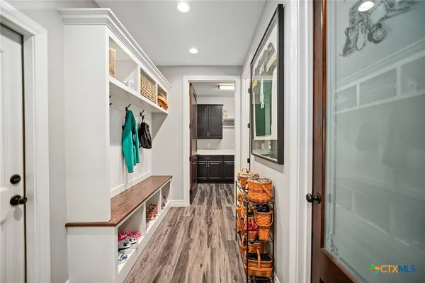 a utility room with sink dryer and washer
