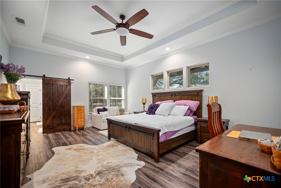 437 Bischoff Road Inez, TX 77968 - Photo 18 of 47 a bedroom with a bed and a large window