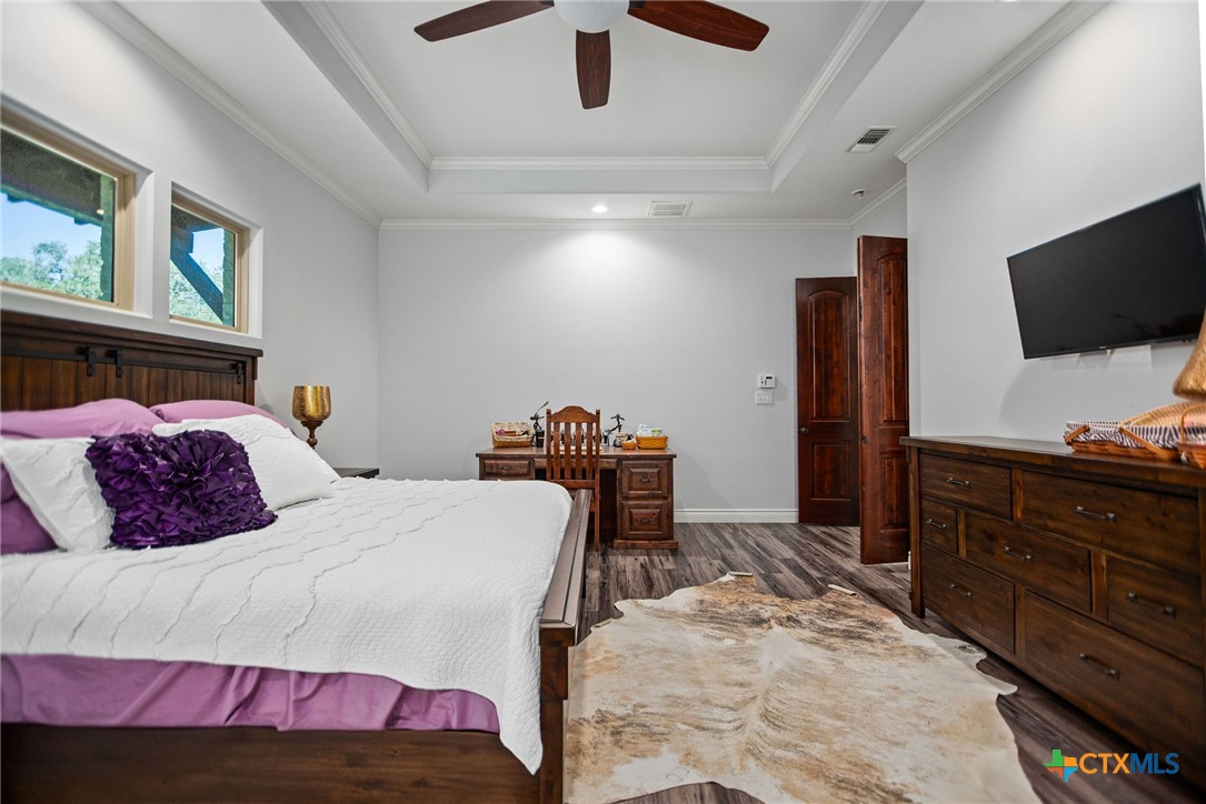 437 Bischoff Road Inez, TX 77968 - Photo 19 of 47 a bedroom with a bed and a flat screen tv