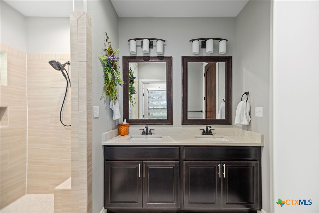 437 Bischoff Road Inez, TX 77968 - Photo 26 of 47 a bathroom with a sink double vanity and a mirror