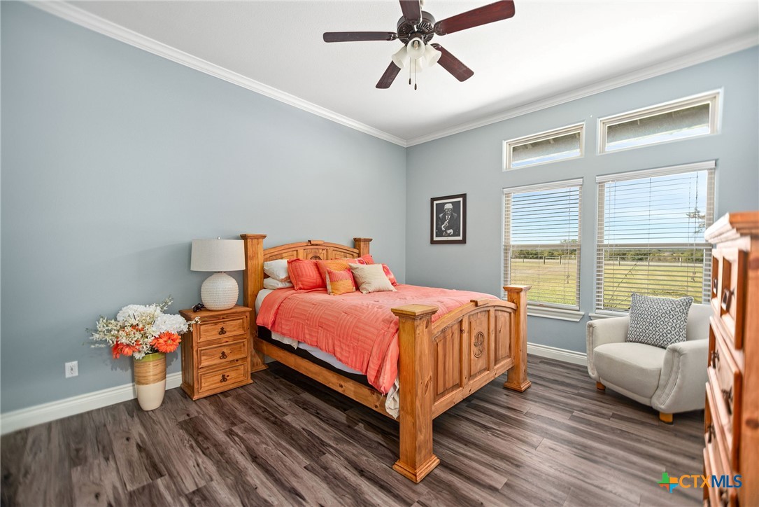 437 Bischoff Road Inez, TX 77968 - Photo 28 of 47 a bedroom with a bed and wooden floor