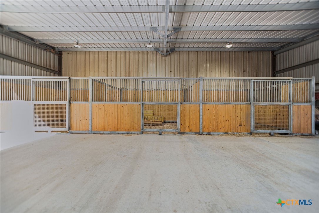 437 Bischoff Road Inez, TX 77968 - Photo 40 of 47 an empty room with wooden floor and windows