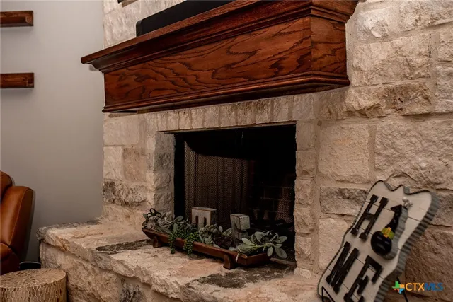 a room with fireplace furniture and a wooden floor