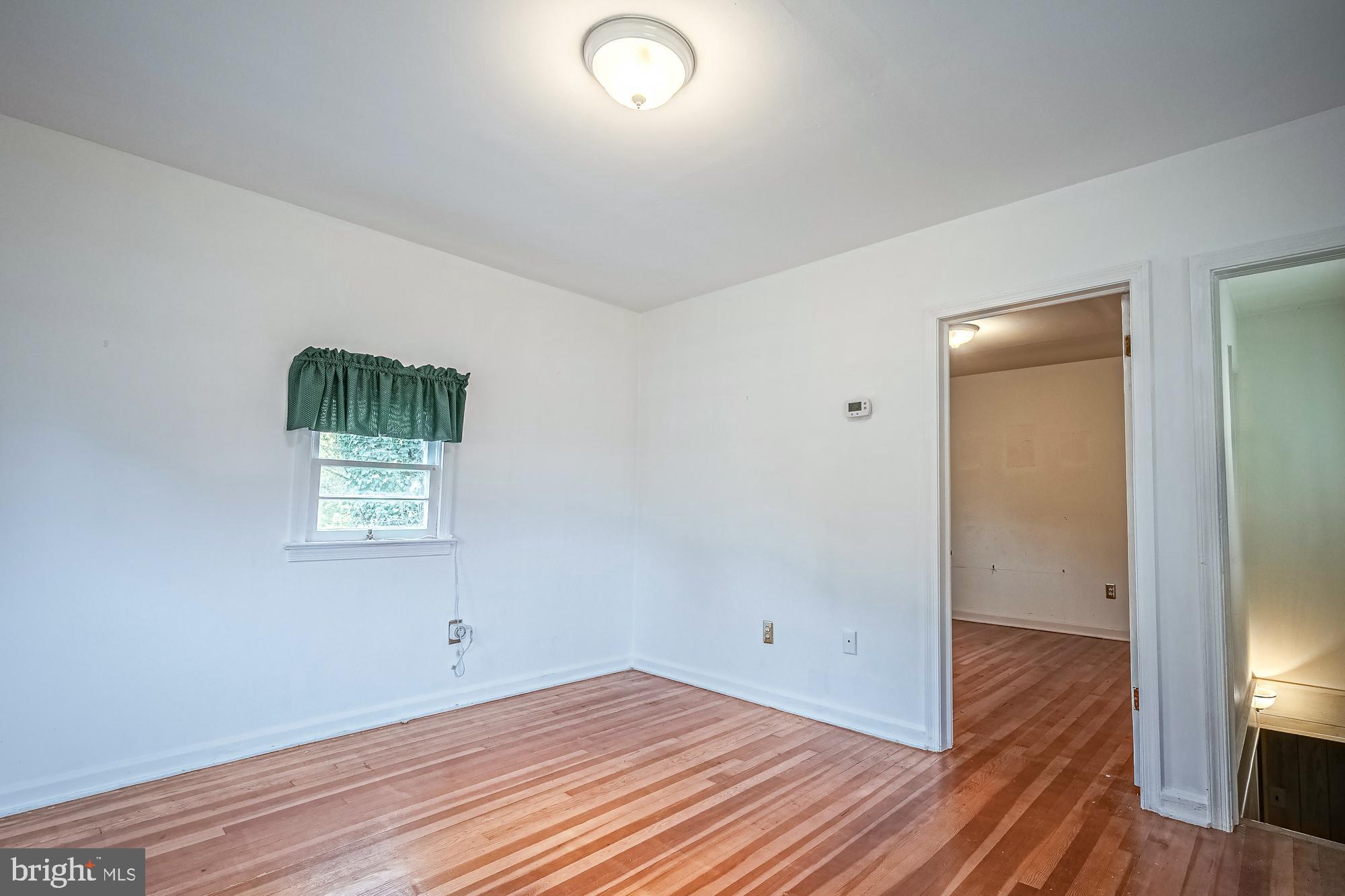 2947 Random Road Falls Church, VA 22042 - Photo 11 of 26 an empty room with wooden floor and windows