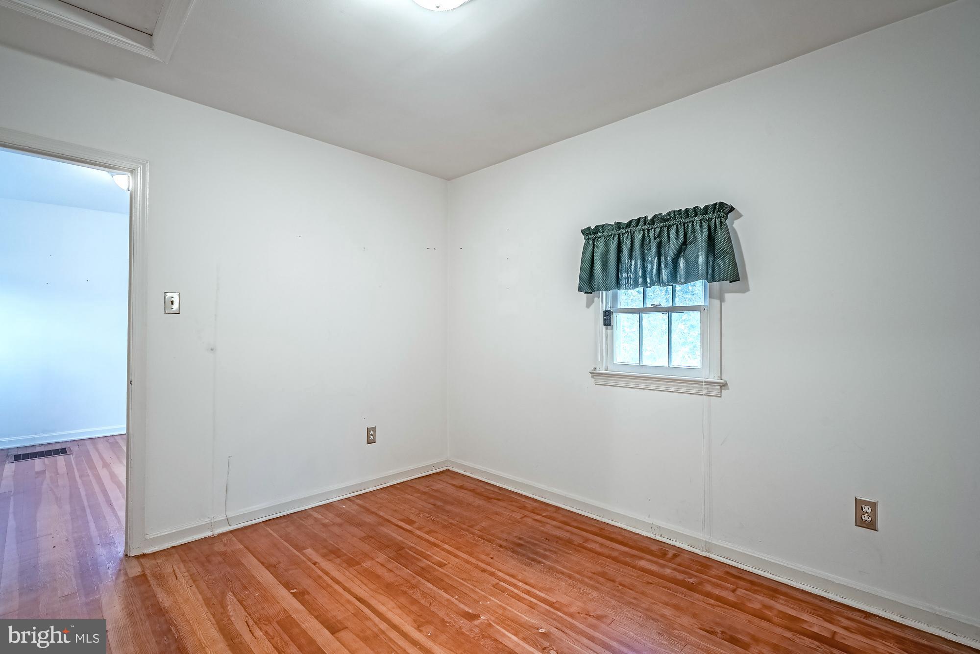 2947 Random Road Falls Church, VA 22042 - Photo 13 of 26 a view of a room with wooden floor and window
