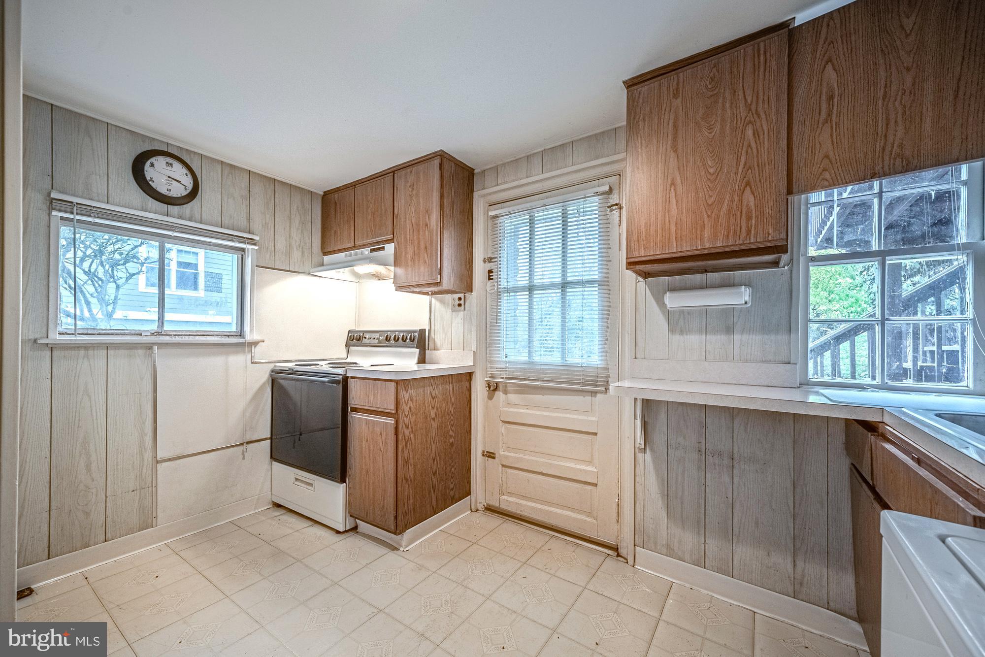 2947 Random Road Falls Church, VA 22042 - Photo 18 of 26 a kitchen with granite countertop wooden cabinets and a stove top oven